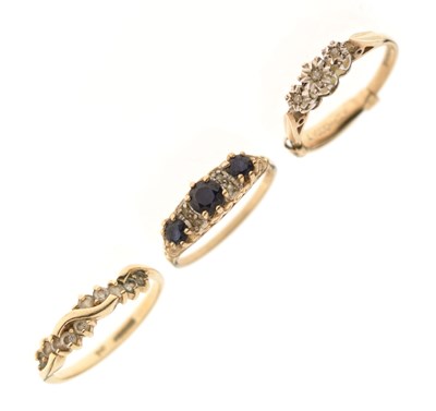 Lot 30 - Three 9ct gold dress rings comprising an illusion set three stone diamond ring, etc