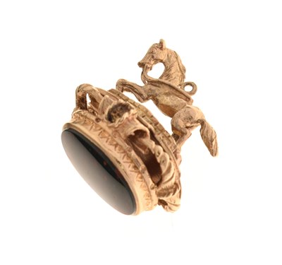 Lot 96 - 9ct gold fob seal modelled as a horse crossing a bridge