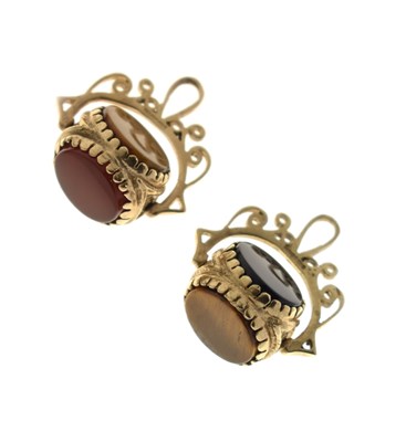 Lot 102 - Pair of 9ct gold swivel fob seals, each set with three panels