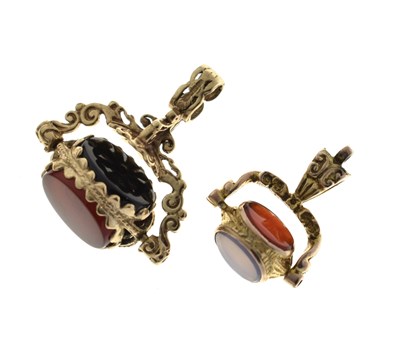 Lot 103 - Two 9ct gold swivel fob seals, each set with three panels