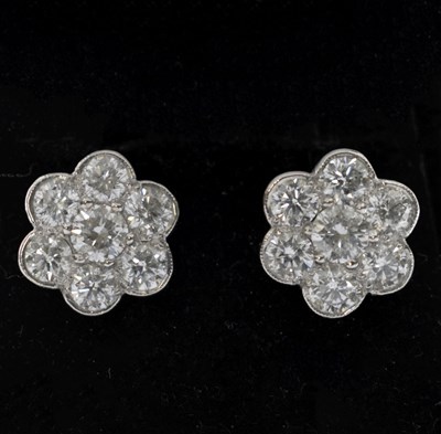Lot 86 - Diamond flowerhead cluster earrings
