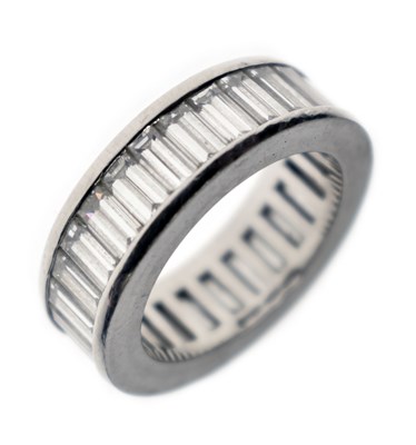 Lot 13 - Baguette cut diamond platinum eternity ring