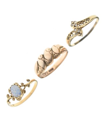 Lot 40 - 9ct rose gold 'keeper' ring, 9ct gold opal dress ring, etc (3)