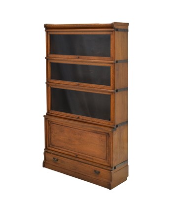 Lot 768 - Globe Wernicke oak four-section mahogany modular bookcase
