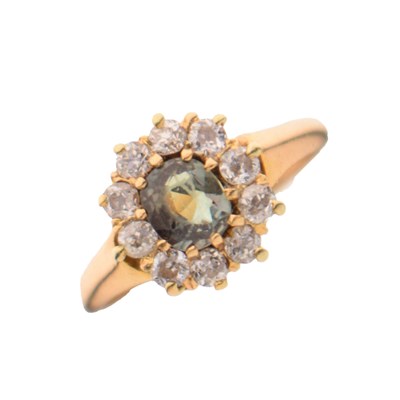 Lot 22 - Green stone and diamond yellow metal cluster ring
