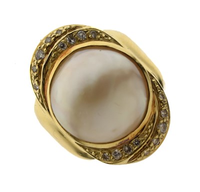 Lot 34 - Mabe pearl and diamond yellow metal ring