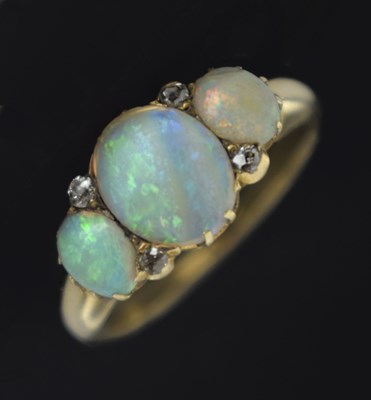 Lot 35 - Opal three stone unmarked yellow metal ring