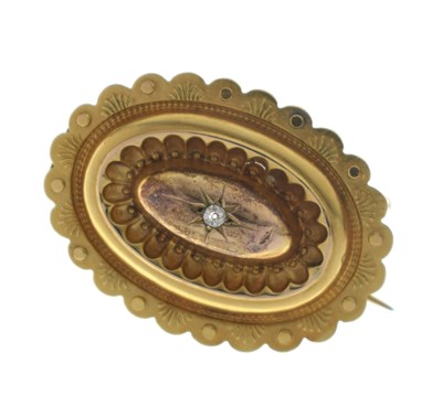 Lot 46 - Victorian diamond yellow metal oval target brooch
