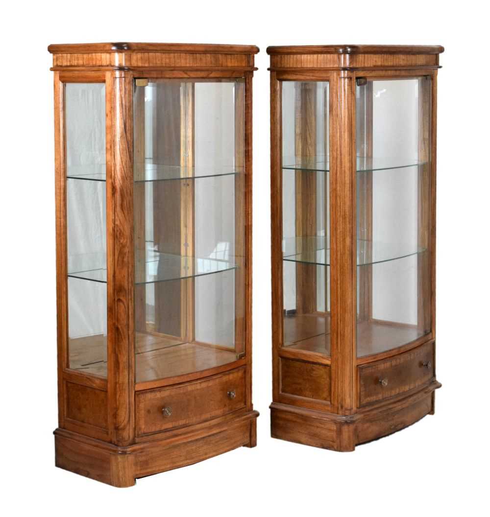 Lot 519 - Pair of Frank Hudson for John Lewis 'Hemingway' display cabinets of bowfront form